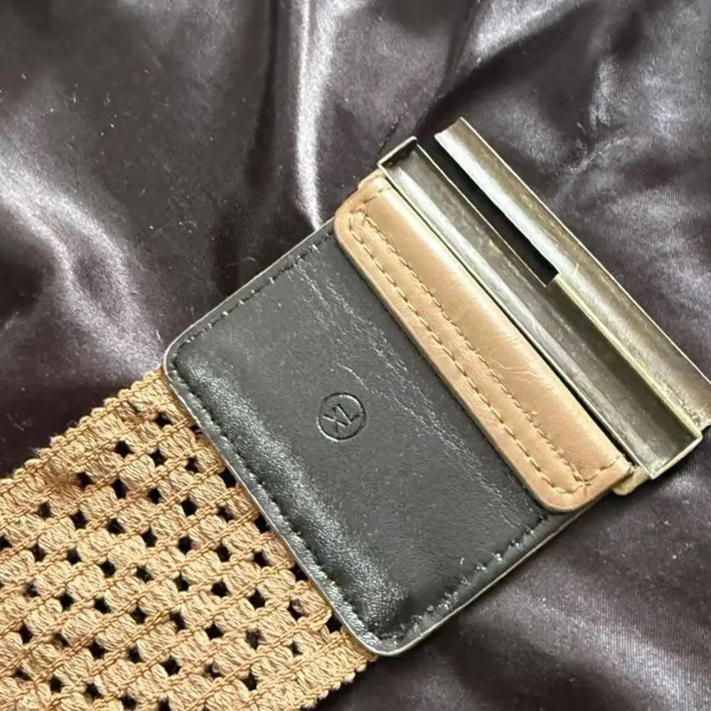 Tan woven belt with gold buckle